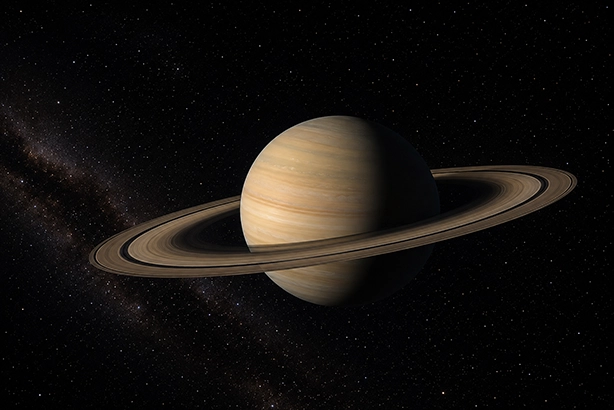 Planeet Saturnus met zijn ringen tegen een achtergrond vol sterren